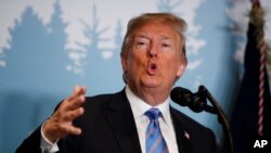 Tổng thống Donald Trump phát biểu trong một cuộc họp báo tại hội nghị thượng đỉnh G7 summit ở La Malbaie, Québec, Canada, ngày 9 tháng 6, 2018. 
