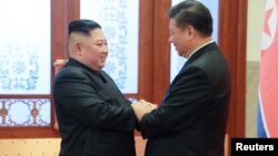 Ông Kim Jong Un trong một cuộc gặp với Chủ tịch Tập đầu năm nay.